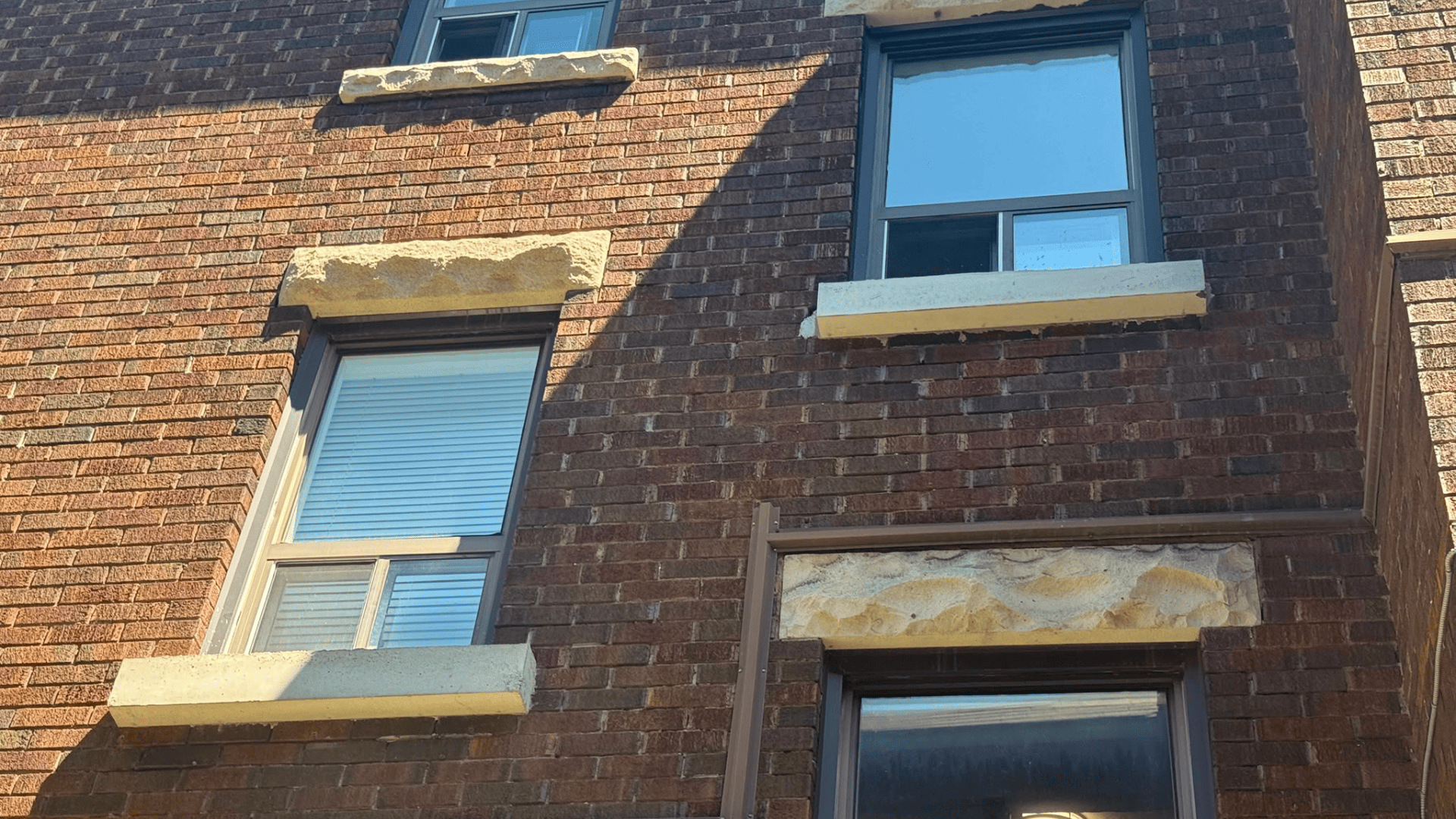 Concrete sill installation above a window